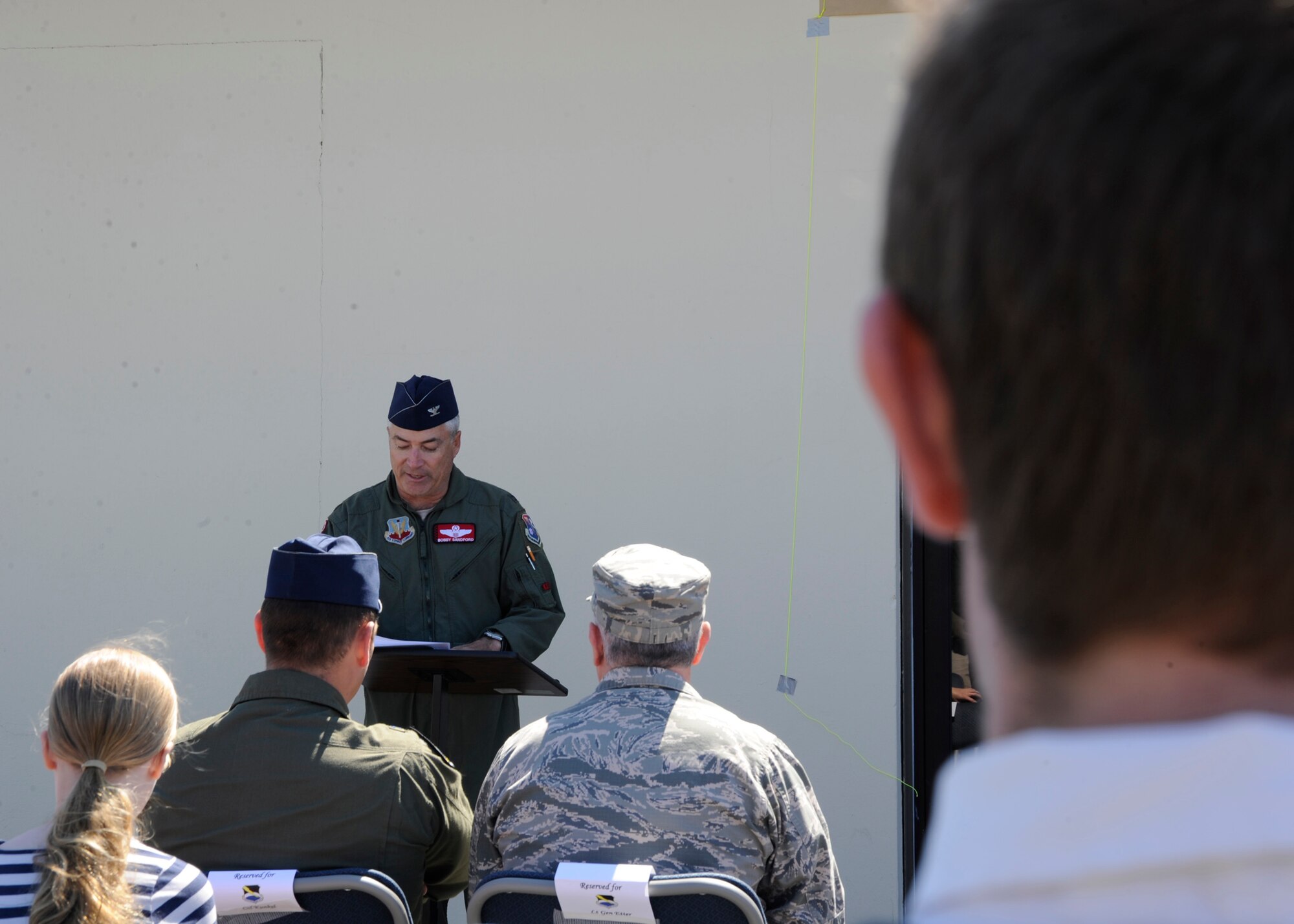 Colonel Robert Sanford, 601st Air Operations Center combat control officer addresses attendees of the Kemp Pilot Gym dedication March 21, at Tyndall, Air Force Base, Fla. The purpose of this event was to commemorate the memory of Col. Larry “Pinball” Kemp. (U.S. Air Force photo by Senior Airman Solomon Cook/Released)