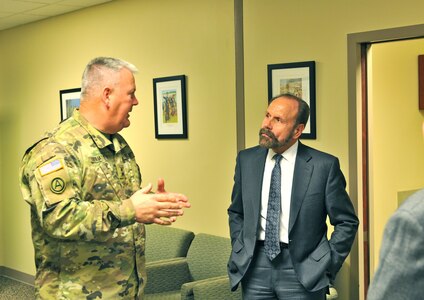 State Sen. Jerry Hill (D) (right), of the California senate, listens to Maj. Gen. Nickolas Tooliatos (left), commanding general, 63rd Regional Support Command, during a meeting at the command headquarters, March 23, Mountain View, Calif. Tooilatos talked with Hill, who represents the 13th Senate District in the California Legislature, about the role of the Army Reserve in the state of California and how they benefit the Bay Area. Hill has over 20 years of public service as an elected official. He was previously the mayor of the city of San Mateo, and also served on the San Mateo County Board of Supervisors where he was a member of the state Assembly.