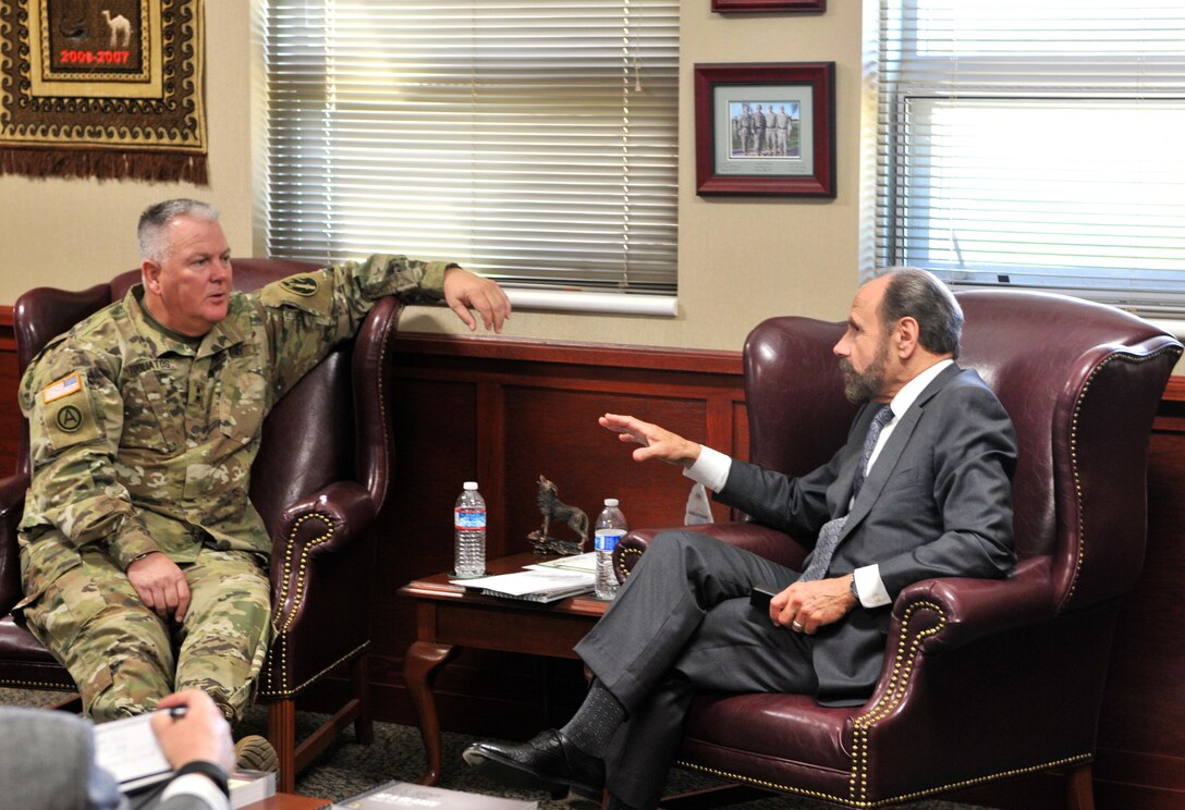 State Sen. Jerry Hill (D) (right), of the California senate, talks with Maj. Gen. Nickolas Tooliatos (left), commanding general, 63rd Regional Support Command, in Tooliatos' office at the command headquarters, March 23, Mountain View, Calif. Tooilatos talked with Hill, who represents the 13th Senate District in the California Legislature, about the role of the Army Reserve in the state of California and how they benefit the Bay Area. Hill has over 20 years of public service as an elected official. He was previously the mayor of the city of San Mateo, and also served on the San Mateo County Board of Supervisors, where he was a member of the state Assembly.