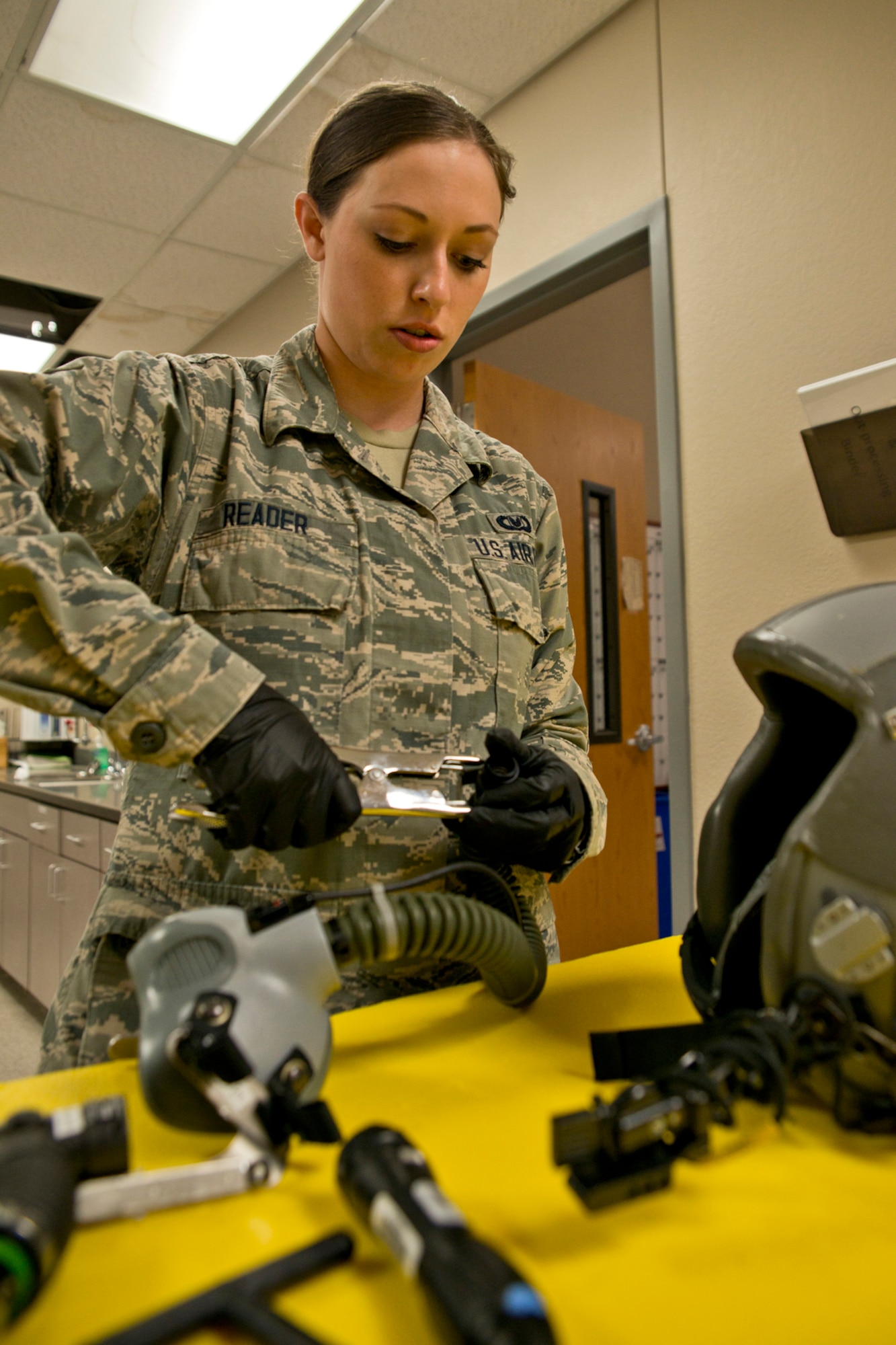 U.S. Air Force Reserve Senior Airman Bobbi Reader, an aircrew flight equipment (AFE) technician assigned to the 913th Operations Support Squadron, inspects an MBU-12/P Oxygen Mask at Little Rock Air Force Base, Ark., Mar. 13, 2016. AFE specialists are responsible for packing emergency items like parachutes and survival kits and maintaining regularly used items like flight helmets and oxygen masks. They ensure all flight and safety equipment is in perfect working order and that aircrews have the supplies necessary for any situation. (U.S. Air Force photo by Master Sgt. Jeff Walston/Released)