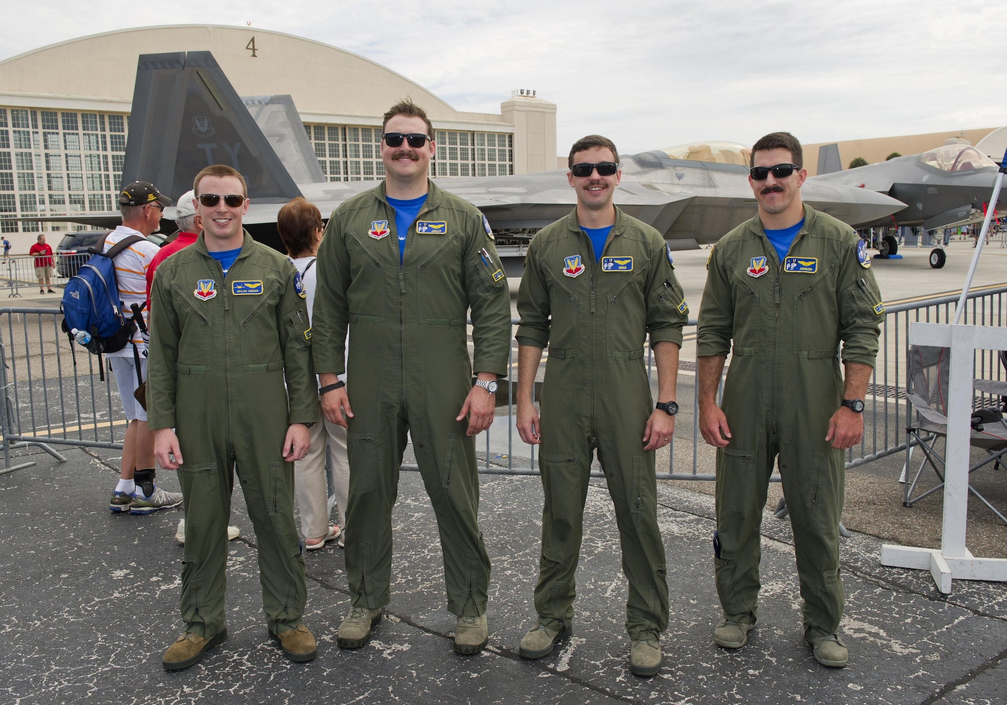 Tyndall F-22 Raptor pilots pose in front of their F-22 during the Tampa Bay AirFest 2016 at MacDill Air Force Base, Fla., March 20, 2016. MacDill hosted spectacular aerial demonstrations, static displays and featured the Air Force Thunderbirds, giving the Tampa Bay community the opportunity to witness firsthand the capabilities of the armed forces. (U.S. Air Force photo by Senior Airman Alex Fox Echols III/Released)