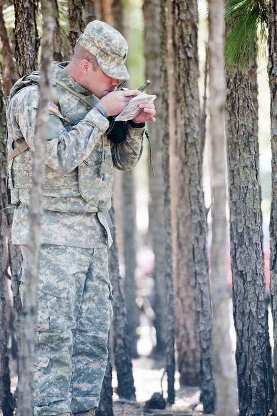 Sgt. David Brown, 98th Training Division (Initial Entry Training), checks his compass reading on the land navigation course at Fort Jackson, S.C., on March 21, during the Best Warrior competition for the 108th Training Command (IET). This year's Best Warrior competition will determine the top noncommissioned officer and junior enlisted Soldier who will represent the 108th Training Command (IET) in the Army Reserve Best Warrior competition later this year at Fort Bragg, N.C. (U.S. Army photo by Maj. Michelle Lunato/released)