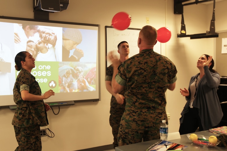 A group of Marines conduct an alcohol abuse prevention exercise using balloons during a Prime for life prevention course at Marine Corps Air Station Cherry Point, N.C., March 17, 2016. Prime for Life is an evidence-based prevention course that helps identify risks associated with alcohol and drug abuse, as well as promote skills for making low-risk choices.  Prime for Life also emphasizes self-assessment, which provides guidance to individuals on how to better understand and accept the need to change personal behaviors. (U.S. Marine Corps photo by Pfc. Nicholas P. Baird/Released)