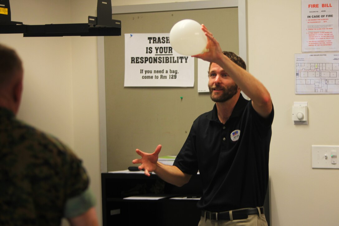 Brenton M. Baker explains an exercise to a group of Marines during a Prime for life prevention course at Marine Corps Air Station Cherry Point, N.C., March 17, 2016. Prime for Life is an evidence-based prevention course that helps identify risks associated with alcohol and drug abuse, as well as promote skills for making low-risk choices.  Prime for Life also emphasizes self-assessment, which provides guidance to individuals on how to better understand and accept the need to change personal behaviors. Baker is an alcohol prevention specialist with Marine Corps Community Services at Cherry Point. (U.S. Marine Corps photo by Pfc. Nicholas P. Baird/Released)