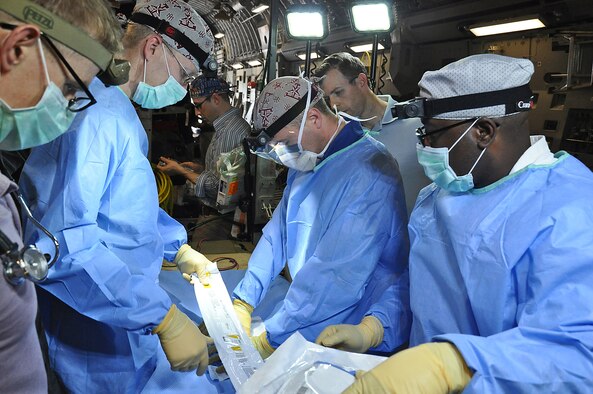 A 59th Medical Wing medical crew from Joint Base San Antonio-Lackland practices procedures while on a C-17 Globemaster III during a presidential support mission to Havana, Cuba. The diplomatic mission marked the first time a sitting U.S. president has visited the communist nation in 88 years. (U.S. Air Force photo/Maj. Wayne Capps)