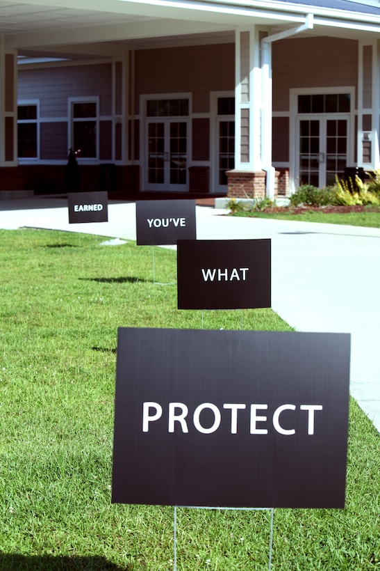 Protect What You’ve Earned Campaign signs line a sidewalk during a “Protect What You’ve Earned” brief at Marine Corps Air Station Cherry Point, N.C., Aug. 18, 2015. The campaign promotes the development of peer support systems and responsible decision-making and actions. It was designed to decrease alcohol-related incidents and all destructive behaviors that decrease readiness and have a negative impact on the Marines, Sailors, their families and the community. (U.S. Marine Corps photo by Pfc. Nicholas P. Baird/Released)