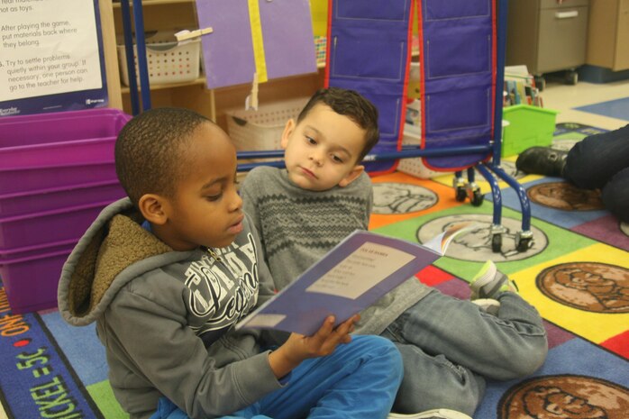 A military child in Sara Rohde’s grade 1-2 class reads to a preschooler during Reading Buddies Day at Crossroads Elementary School aboard Marine Corps Base Quantico Mar. 15. The Reading Buddies program was part of Read Across America, an annual reading motivation and awareness campaign sponsored by the National Education Association to coincide with the Mar. 2 birthday of beloved children’s author Dr. Seuss.