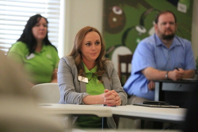 Leslie May, palm housing district manager, Lincoln Military Housing, listens to a member of the Resident Advisory Board speak during the board’s meeting at the Ocotillo Club House, March 17, 2016. RAB discusses the status of the housing program along with tracking the needs and trends of service members and their families. (Official Marine Corps photo by Cpl. Julio McGraw/Released)