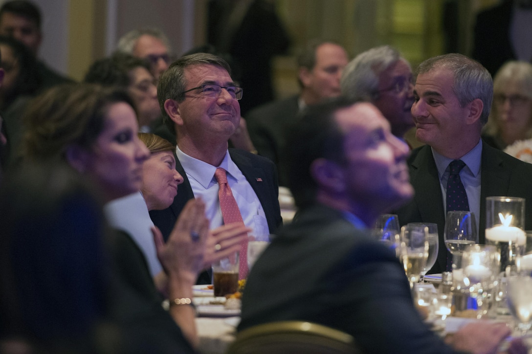 Defense Secretary Ash Carter and his wife, Stephanie, watch a video honoring Carter during the Center for the Study of the Presidency and Congress awards dinner in Washington D.C., March 23, 2016, where he received the Eisenhower Award for leadership in national security affairs. DoD photo by Senior Master Sgt. Adrian Cadiz