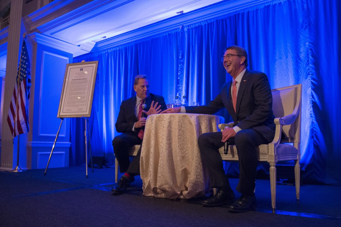 Defense Secretary Ash Carter, right, answers questions during a fireside chat with Mike Rogers during the Center for the Study of the Presidency and Congress awards dinner in Washington, D.C., March 23, 2016. Rogers is a members of the center's board of trustees and a former U.S. representative from Michigan. DoD photo by Senior Master Sgt. Adrian Cadiz