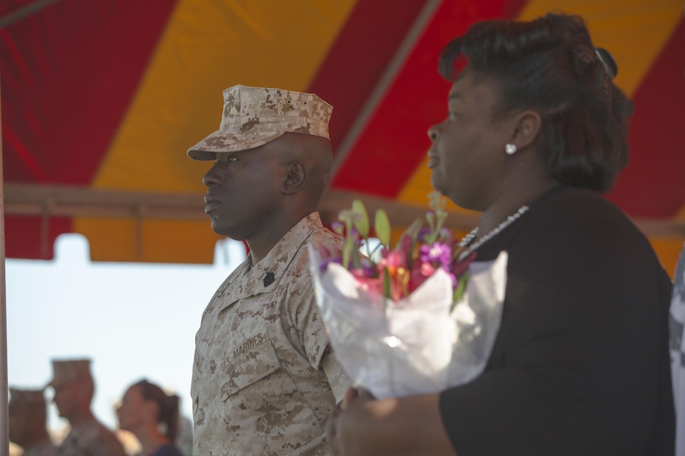 Sgt. Maj. Marcus A. Chestnut, incoming battalion sergeant major, 3rd Light Armored Reconnaissance Battalion, stands with his wife, Belinda Chestnut, during the battalion’s relief and appointment ceremony at Felix Field March 18, 2016. During the ceremony, Sgt. Maj. Edward G. Zapata relinquished his position as battalion sergeant major of 3rd LAR to Chestnut. (Official Marine Corps photo by Lance Cpl. Levi Schultz/Released)