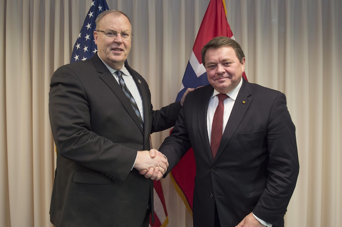 Deputy Defense Secretary Bob Work, left, poses for a photo with Norwegian State Secretary for Defense Oystein Bo at the Pentagon, March 24, 2016. DoD photo by Air Force Senior Master Sgt. Adrian Cadiz