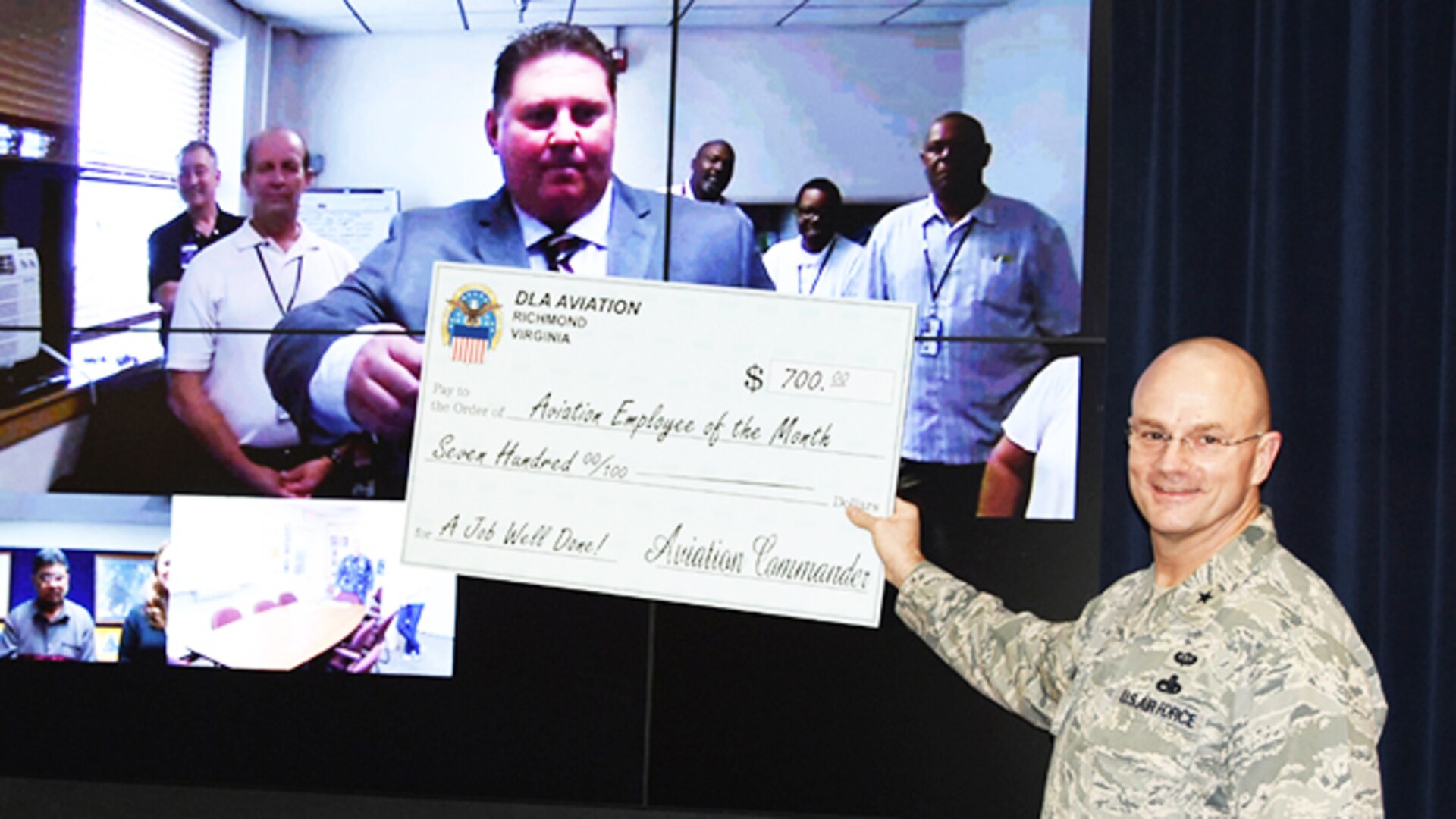 Defense Logistics Agency Aviation Naval Air Station at Jacksonville Florida employee David Scott was honored as the January 2016 Employee of the Month in a video teleconference ceremony at Defense Supply Center Richmond, Virginia, March 16, 2016. Scott works as an equipment specialist in the Customer Operations Directorate.