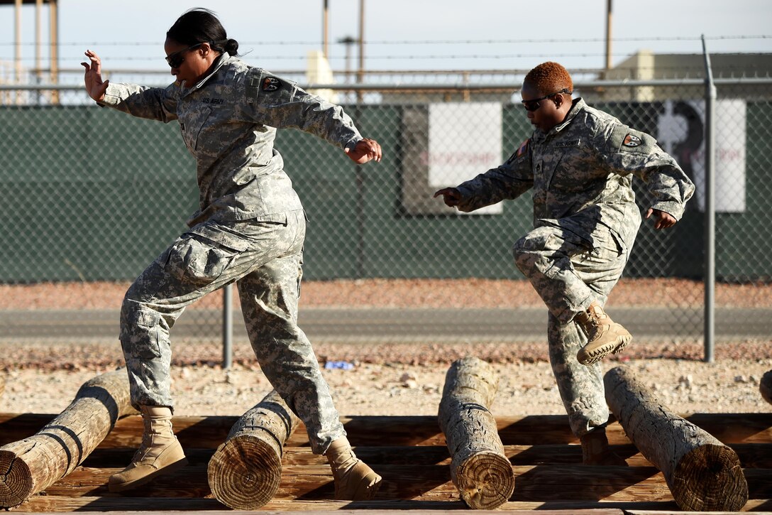 Participants negotiate an obstacle during Operational Contract Support Joint Exercise 2016 at Fort Bliss, Texas, March 22, 2016. Air Force photo by Staff Sgt. Jonathan Snyder