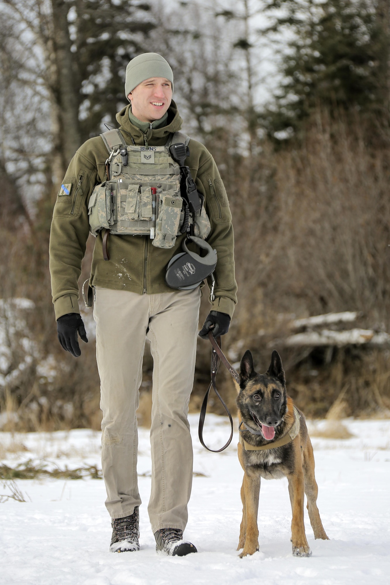 U.S. Air Force Staff Sgt. Joe Burns and military working dog, Ciko, assigned to the 673rd Security Forces Squadron, conduct K-9 training at Joint Base Elmendorf-Richardson, Alaska, March 17, 2016. The Security Forces Airmen conducted the K-9 training with their Army counterparts, assigned to the 549th Military Working Dog Detachment, to keep their teams flexible to respond to law enforcement emergencies, and for overseas deployments. (U.S. Air Force photo/Alejandro Pena)