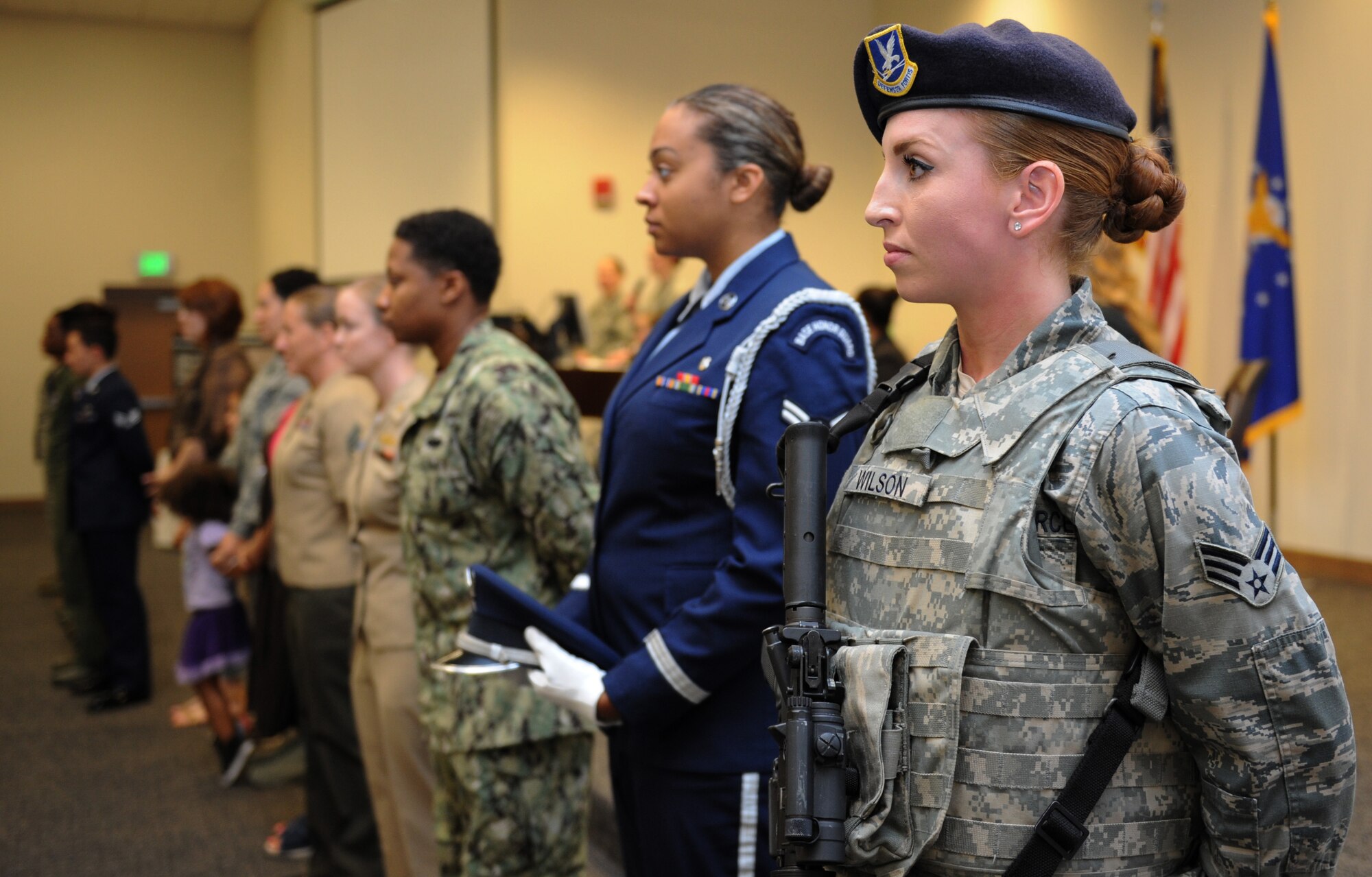 Senior Airman Catherine Wilson, 81st Security Forces Squadron electronic security systems and Defense Biometric Identification System technician, stands among fellow service members during the National Women’s History Fair at the Roberts Consolidated Maintenance Facility Mar. 24, 2016, Keesler Air Force Base, Miss. The event was held in honor of National Women’s History Month.  Also included, were health and informational booths, a guest panel of accomplished women and a presentation honoring Keesler women of distinction. (U.S. Air Force photo by Kemberly Groue)