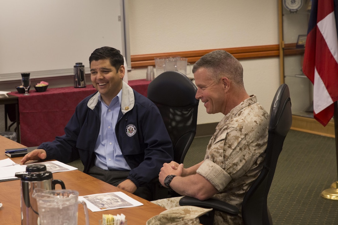 Maj. Gen. Lewis A. Craparotta, Combat Center Commanding General, explains the mission of the Combat Center to Congressman Raul Ruiz during his visit to the Combat Center, March 18, 2016. Ruiz serves as the congressman for California’s 36th District and the purpose of his visit was to discuss the various programs aboard the installation and engage with command leadership to gain a understanding of the Combat Center’s unique capabilities. (Official Marine Corps photo by Cpl. Medina Ayala-Lo/Released)