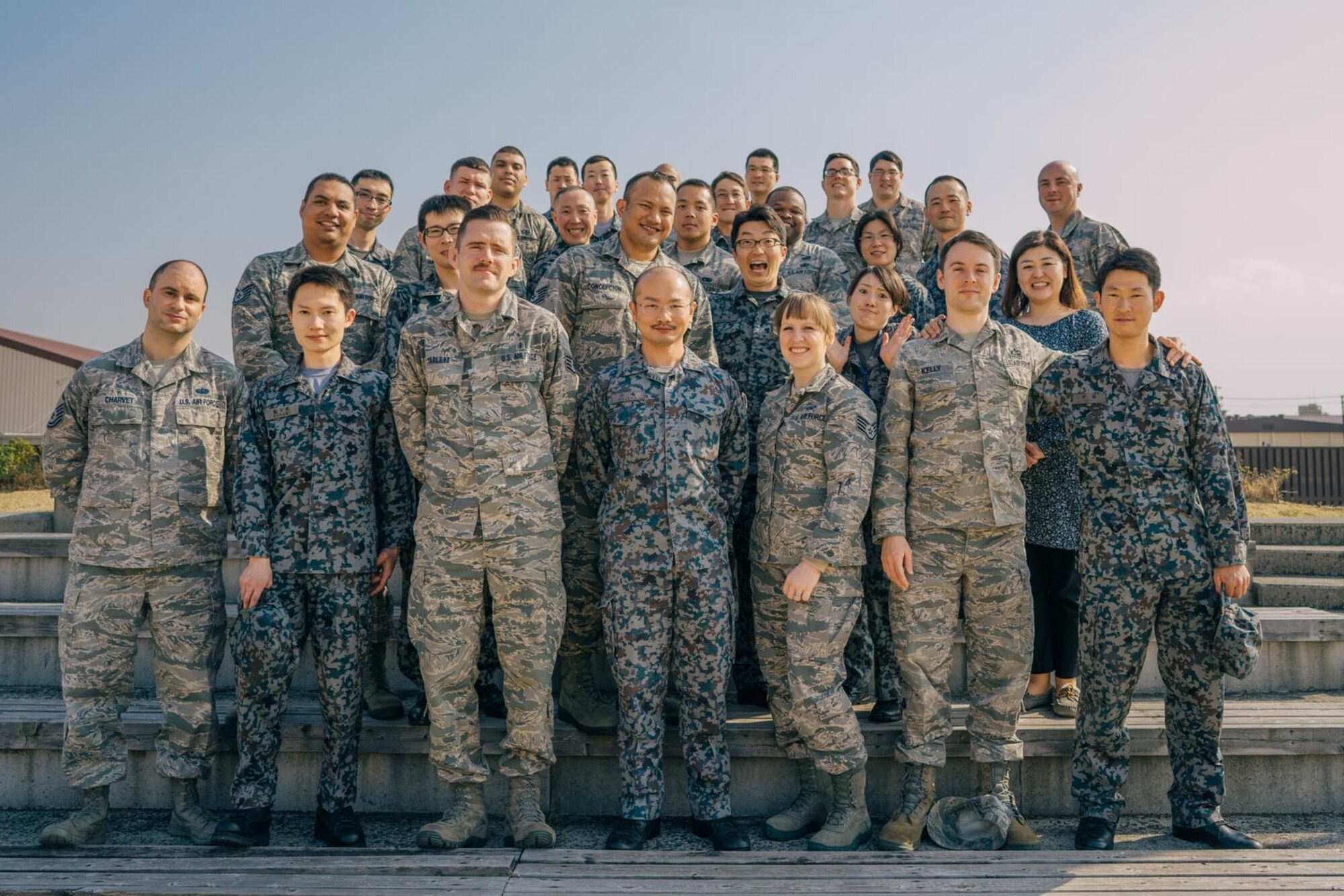 Participants of the 16th Annual Non-Commission Officer Exchange Program pose for a photo at Yokota Air Base, Japan, March 23, 2016. A total of 16 Japan Air Self Defense Force Airmen from a variety of career fields participated in this year’s NCOEP, which provides an opportunity for participants to enhance communications and understanding of different operations between both military organizations. (U.S. Air Force photo by Airman 1st Class Delano Scott/Released)