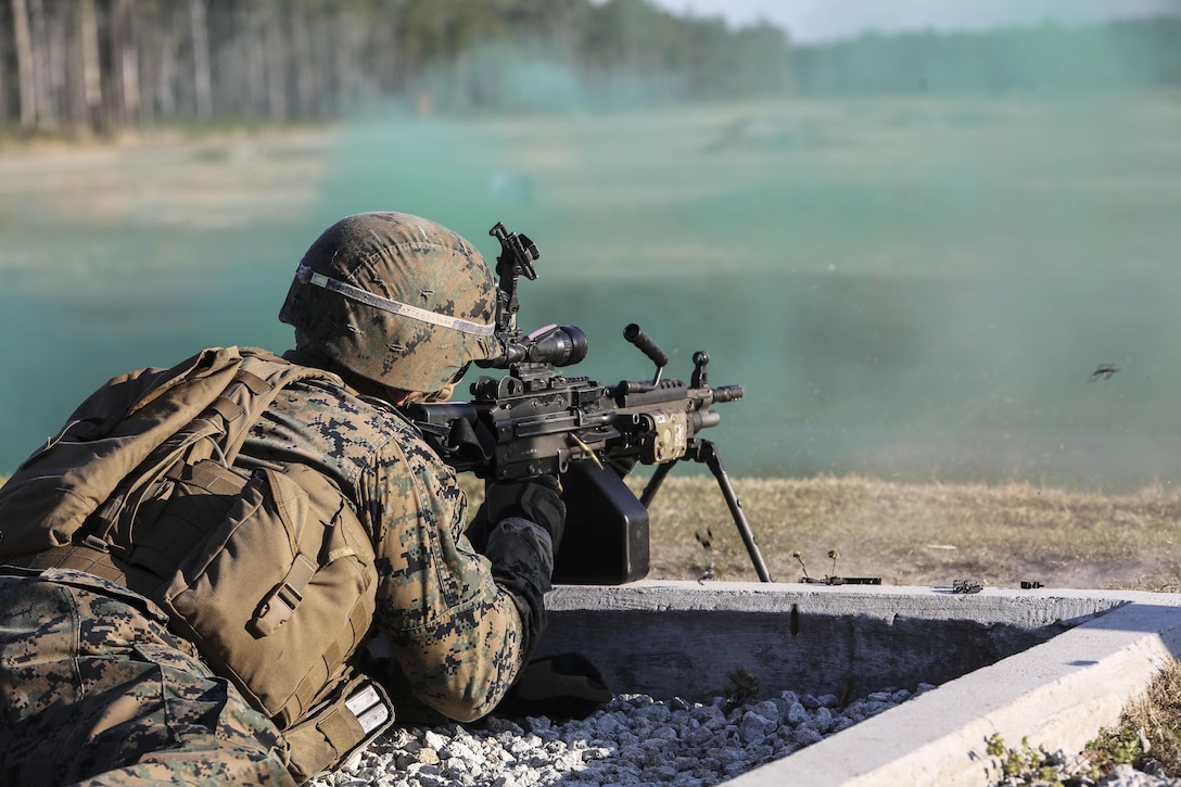 A Marine with 2nd Combat Engineer Battalion engages targets with an M249 squad automatic weapon during the machine gun range portion of the battalion’s sapper squad competition at Camp Lejeune, N.C., March 23, 2016. During this event, squads worked together to engage targets at ranges up to 800 meters. (U.S. Marine Corps photo by Cpl. Paul S. Martinez/Released)