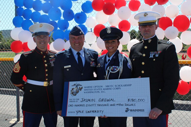 (From left to right) Staff Sgt. Joseph Colby, Retired Air Force Col. Mark Hustedt, Cadet Col. Jasmin Grewal, and Capt. Jeffrey Newman pose for a photo after Jasmin received the U.S. Marine Corps Naval Reserve Officers Training Corps (NROTC) scholarship during a presentation at Royal High School in Simi Valley, Calif., March 24, 2016. Grewal won the scholarship based on her commitment in and out of the classroom, to the community, leadership abilities, and physical fitness, and plans to attend Yale University. (U.S. Marine Corps photo by Staff Sgt. Alicia R. Leaders/Released) 