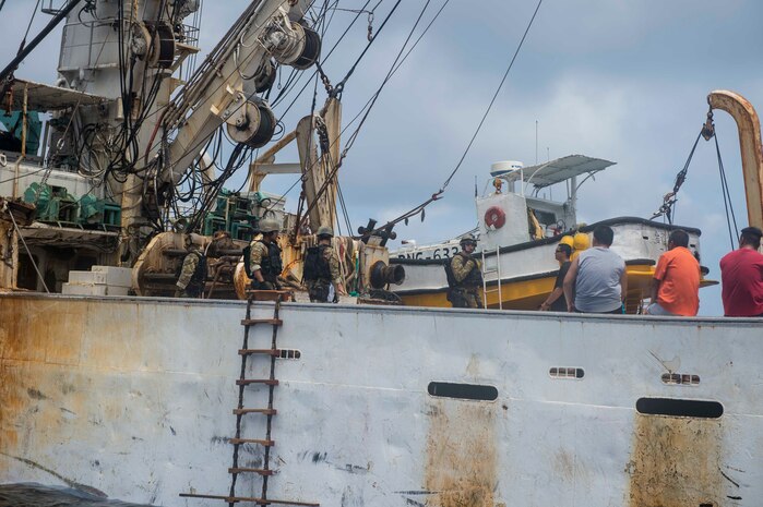 PACIFIC OCEAN (Feb. 22, 2016) -- Sailors from the guided-missile destroyer USS William P. Lawrence (DDG 110) and Coast Guardsman assigned to the U.S. Coast Guard Tactical Law Enforcement Team South investigate a commercial fishing vessel. Providing a ready force supporting security and stability in the Indo-Asia Pacific, William P. Lawrence, commanded by Cmdr. Walter C. Mainor, is operating as part of the John C. Stennis Strike Group and Great Green Fleet on a regularly scheduled 7th Fleet deployment. (U.S. Navy photo by Mass Communication Specialist 3rd Class Emiline L. M. Senn/Released)