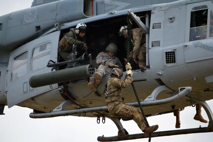 A U.S. Army Soldier assigned to Comanche Troop, 3rd Squadron, 4th Cavalry Regiment, 3rd Brigade Combat Team, 25th Infantry Division, begins his descent from a Marine Corps UH-1Y "Venom" helicopter at Marine Corps Training Area Bellows, Hawaii, on March 22, 2016. The 3-4th Cav. Regt. conducted rappel operations, fast rope insertion extraction system (FRIES) and helocasts March 21-23. (Photo by Staff Sgt. Armando R. Limon, 3rd Brigade Combat Team, 25th Infantry Division)