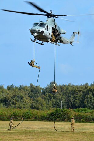 U.S. Army Soldiers assigned to Comanche Troop, 3rd Squadron, 4th Cavalry Regiment, 3rd Brigade Combat Team, 25th Infantry Division, prepares to land from fast roping down a Marine Corps UH-1Y "Venom" helicopter at Marine Corps Training Area Bellows, Hawaii, on March 22, 2016. The Soldiers, along with Airmen assigned to the 25th Air Support Squadron, conducted fast rope insertion extraction system (FRIES) operations together from Marine Light Attack Helicopter Squadron 367's helicopter to enhance interoperability in a joint environment. (Photo by Staff Sgt. Armando R. Limon, 3rd Brigade Combat Team, 25th Infantry Division)