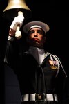 160323-N-FJ200-130 WASHINGTON (March 23, 2016) Seaman Michael Santiago from the U.S. Navy Ceremonial Guard rings a bell 56 times to honor the 56 crewmembers of USS Conestoga (AT 54) lost at sea during a ceremony at the U.S. Navy Memorial. (U.S. Navy photo by Mass Communication Specialist 1st Class Clifford L. H. Davis/Released)