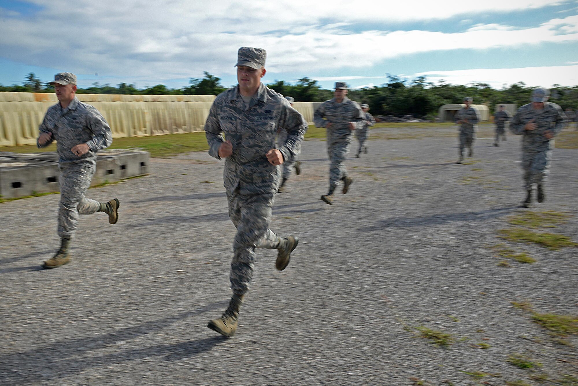 Airmen with the 36th Civil Engineer Squadron run during a Prime Base Engineer Emergency Force exercise March 24 at Andersen Air Force Base, Guam. Airmen with the 36th CES honed their skills in a simulated combat environment and night vision training as well as classroom lessons during the Prime BEEF exercise. (U.S. Air Force Photo/ Airman 1st Class Alexa Ann Henderson)