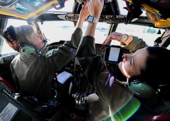 Col. Kristin Goodwin, the 2nd Bomb Wing commander, and Maj. Heather Decker, a 93rd Bomb Squadron instructor pilot, go through their preflight checklist prior to takeoff at Barksdale Air Force Base, La., March 22, 2016. (U.S. Air Force photo/2nd Lt. Jessica Adams)