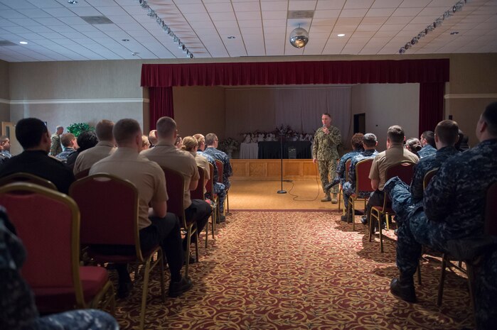 The Master Chief Petty Officer of the Navy, Mike Stevens briefs more than 100 Sailors during an all hands event at the Joint Base Charleston – Weapons Station, S.C., March 24, 2016. Stevens was visiting the base as part of a two-week tour of East Coast military bases, from Norfolk, Virginia to Key West Fla.  Stevens wanted to communicate face-to-face with Sailors. (U.S. Air Force photo/Staff Sgt. Jared Trimarchi)