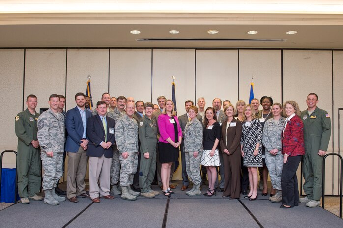 Members of Joint Base Charleston leadership and Honorary Commanders pose for a group photo during the Honorary Commanders Induction Ceremony, March 23, 2016 at JB Charleston – Air Base, S.C. The purpose of the Honorary Commanders Program is to increase public awareness and understanding of JB Charleston mission, policies, and programs within the base, and in the local area and surrounding communities in order to foster goodwill, understanding, support and acceptance from the Low Country leaders and community members. (U.S. Air Force photo/Staff Sgt. George Goslin)