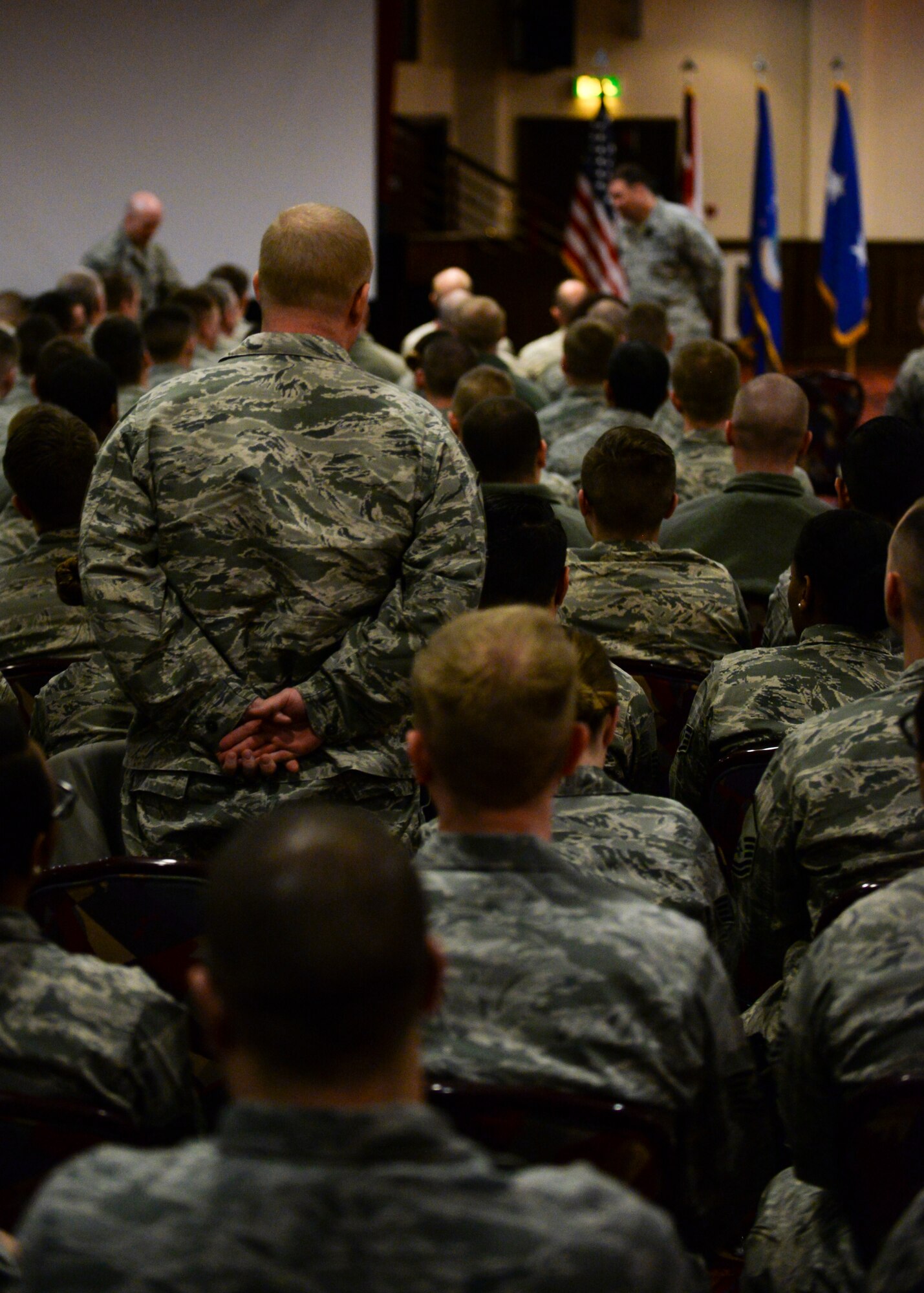 U.S. Air Force Airmen ask Maj. Gen. Christopher Bence, 3rd Air Force vice commander, questions during an enlisted all call March 24, 2016, at RAF Mildenhall, England. Aside from speaking to Airmen throughout the base, Bence presented Airmen with challenge coins for their accomplishments and hosted three separate all calls for enlisted, officer and squadron commanders of Team Mildenhall. (U.S. Air Force photo by Senior Airman Victoria H. Taylor/Released)