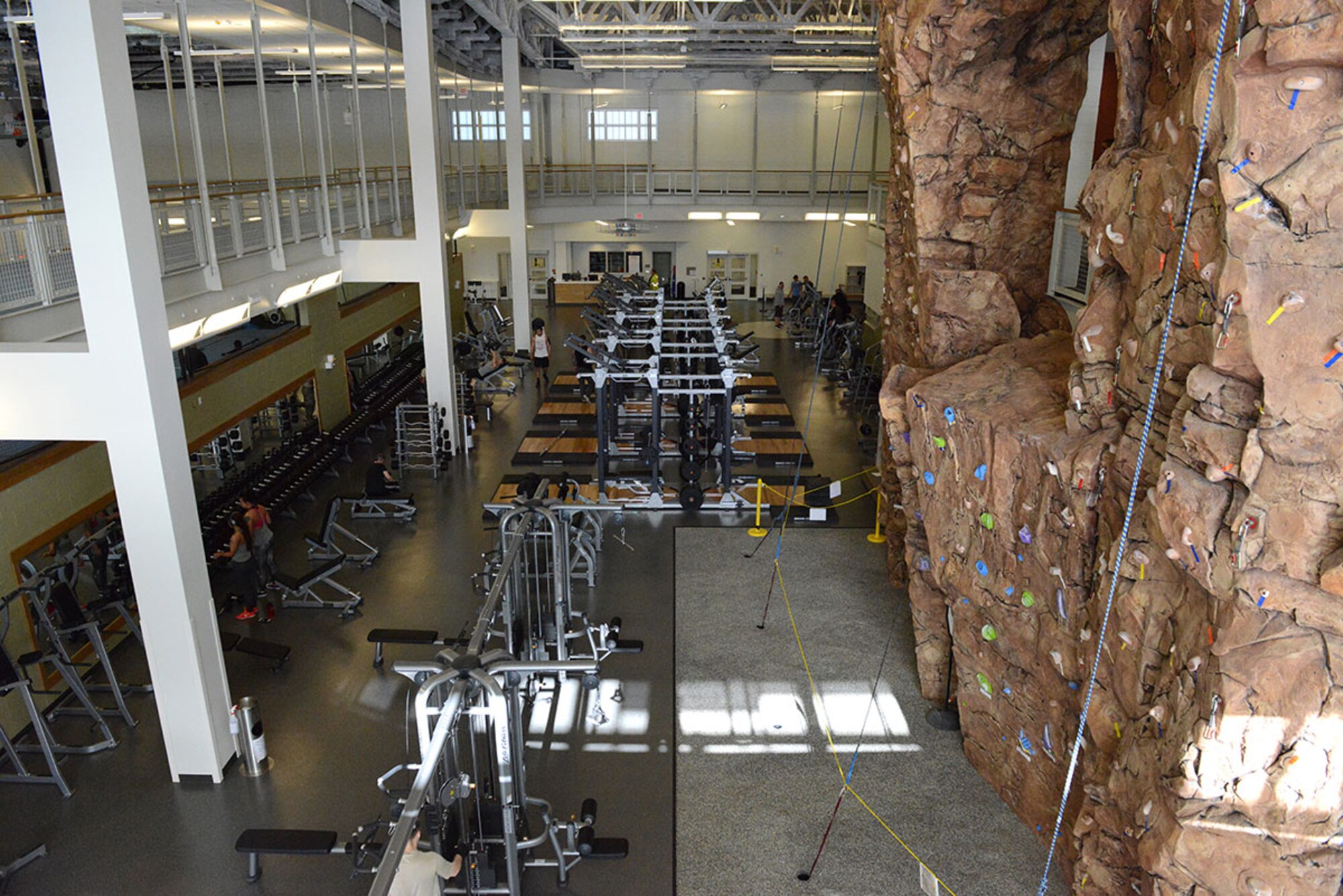 An indoor running track, free weights and rock-climbing wall sit ready for use following a ribbon-cutting ceremony at the new Buckner Physical Fitness Center expansion March 21. The 35,000 square-foot state-of-the-art addition to Buckner also includes an aquatic center, Pulastic court, and a plethora of new strength and cardio machines. (U.S. Air Force photo by Staff Sgt. Wes Wright)