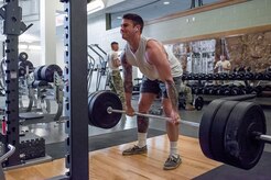 Private First Class Cole Alfafara, 4th Infantry Brigade Combat Team (Airborne), 25th Infantry Division, 6th Brigade Engineer Battalion (Airborne), combat engineer, performs a deadlift in the new expansion at Buckner Physical Fitness Center March 21. The 35,000 square-foot state-of-the-art addition to Buckner also includes an aquatic center, Pulastic court, rock climbing wall, indoor running track and a plethora of new strength and cardio machines. (U.S. Air Force photo by Staff Sgt. Wes Wright)