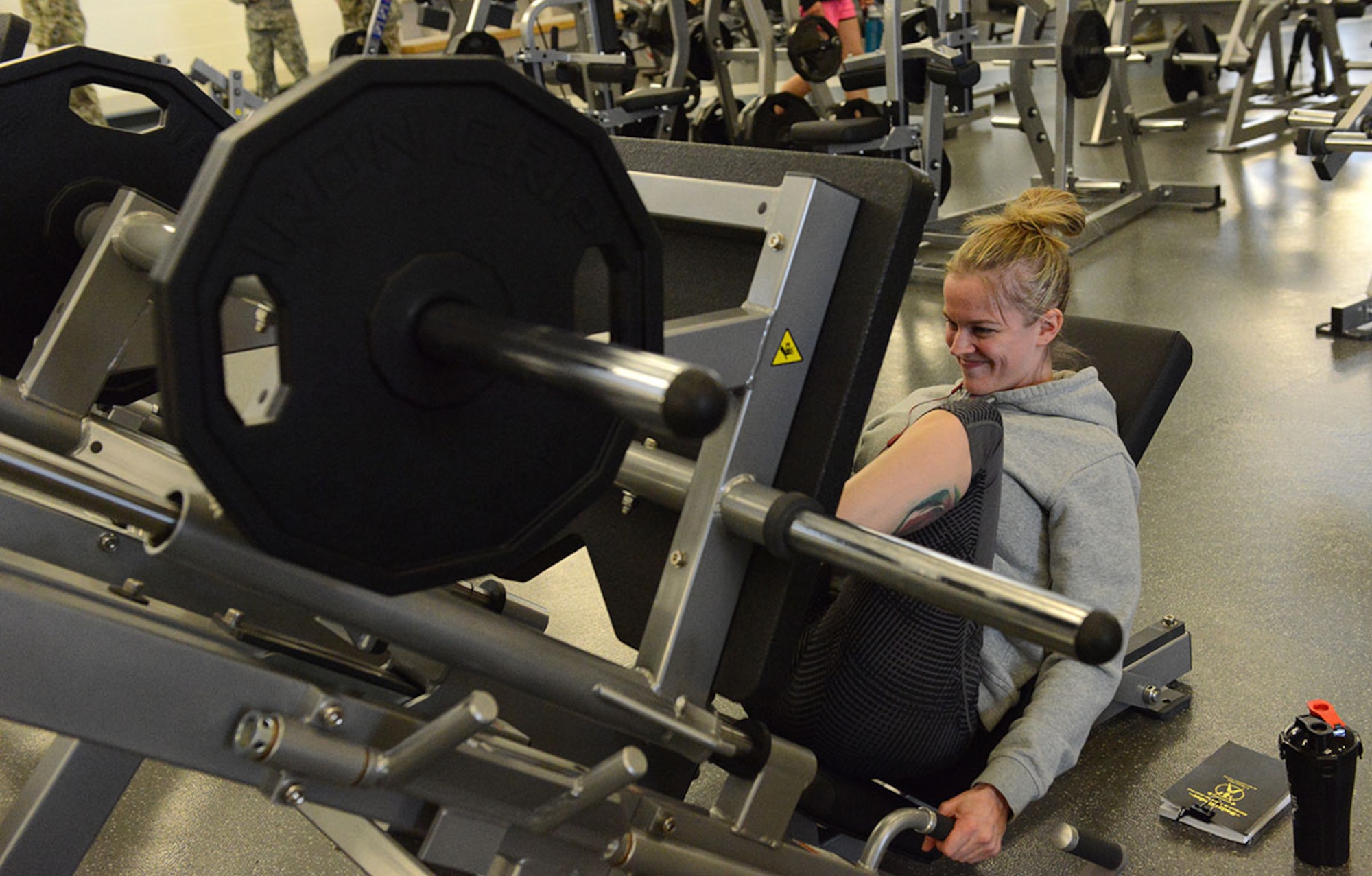 Specialist Heather York, 59th Signal Battalion, United States Army Alaska, computer information specialist, performs a leg press exercise in the new expansion at Buckner Physical Fitness Center March 21. The 35,000 square-foot state-of-the-art addition to Buckner also includes an aquatic center, Pulastic court, rock climbing wall, indoor running track and a plethora of new strength and cardio machines. (U.S. Air Force photo by Staff Sgt. Wes Wright)