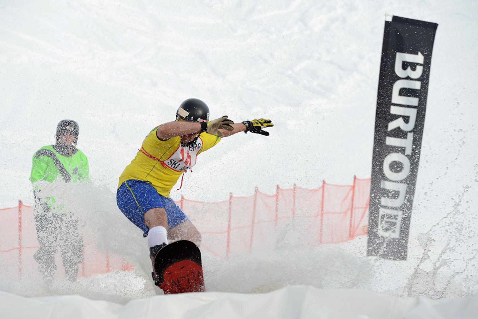 A competitor snowboards across the slush pond during Hillberg Ski Resort’s Slush Cup at Joint Base Elmendorf-Richardson, Alaska, March 20, 2016. Participants skied or snowboarded across a slush pond, and prizes were given to a select few who made the cleanest run, sickest dive, and more. (U.S. Air Force photo by Airman 1st Class Christopher R. Morales)
