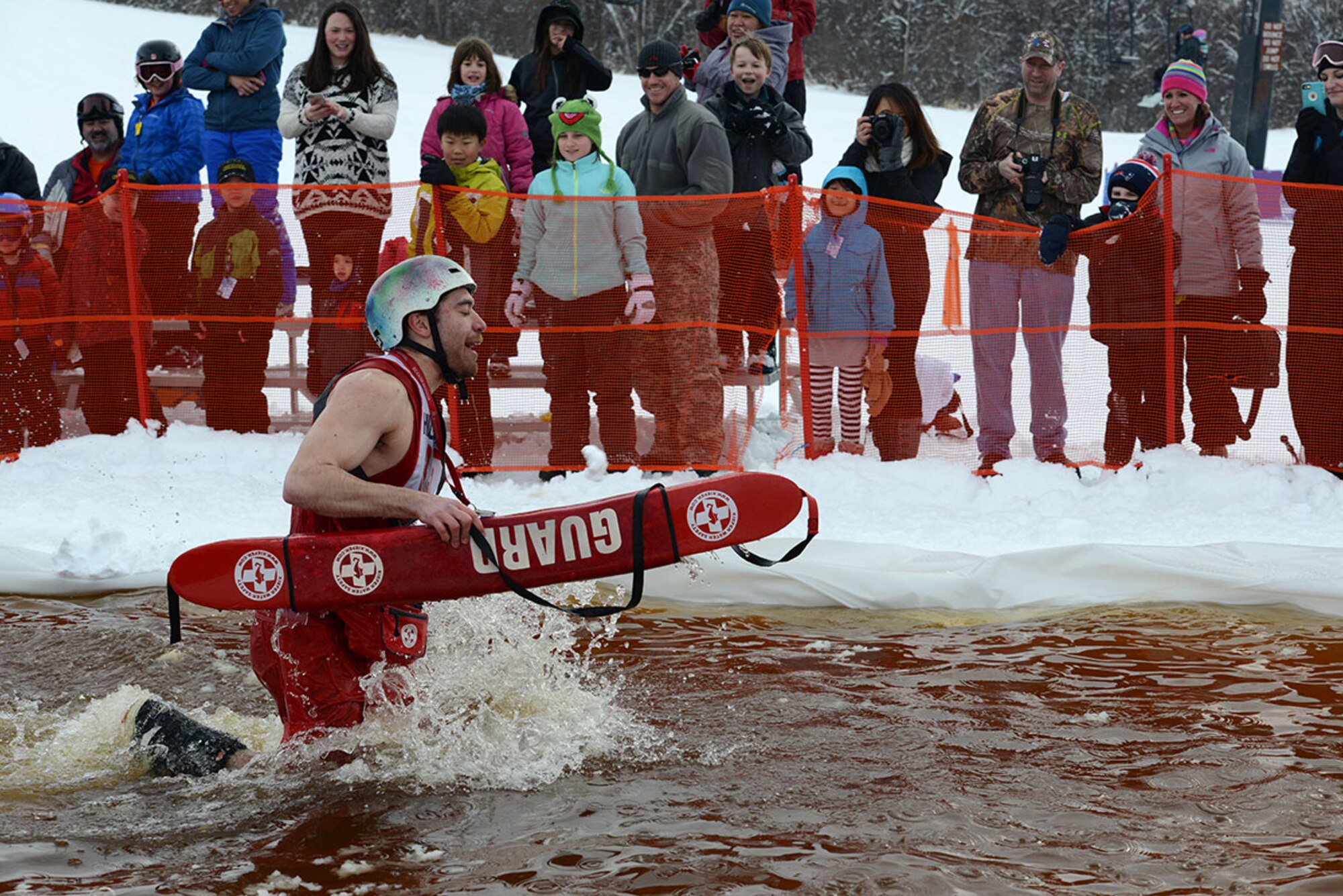 A competitor trudges through the slush pond during Hillberg Ski Resort’s Slush Cup at Joint Base Elmendorf-Richardson, Alaska, March 20, 2016. Participants skied or snowboarded across a slush pond, and prizes were given to a select few who made the cleanest run, sickest dive, and more. (U.S. Air Force photo by Airman 1st Class Christopher R. Morales)
