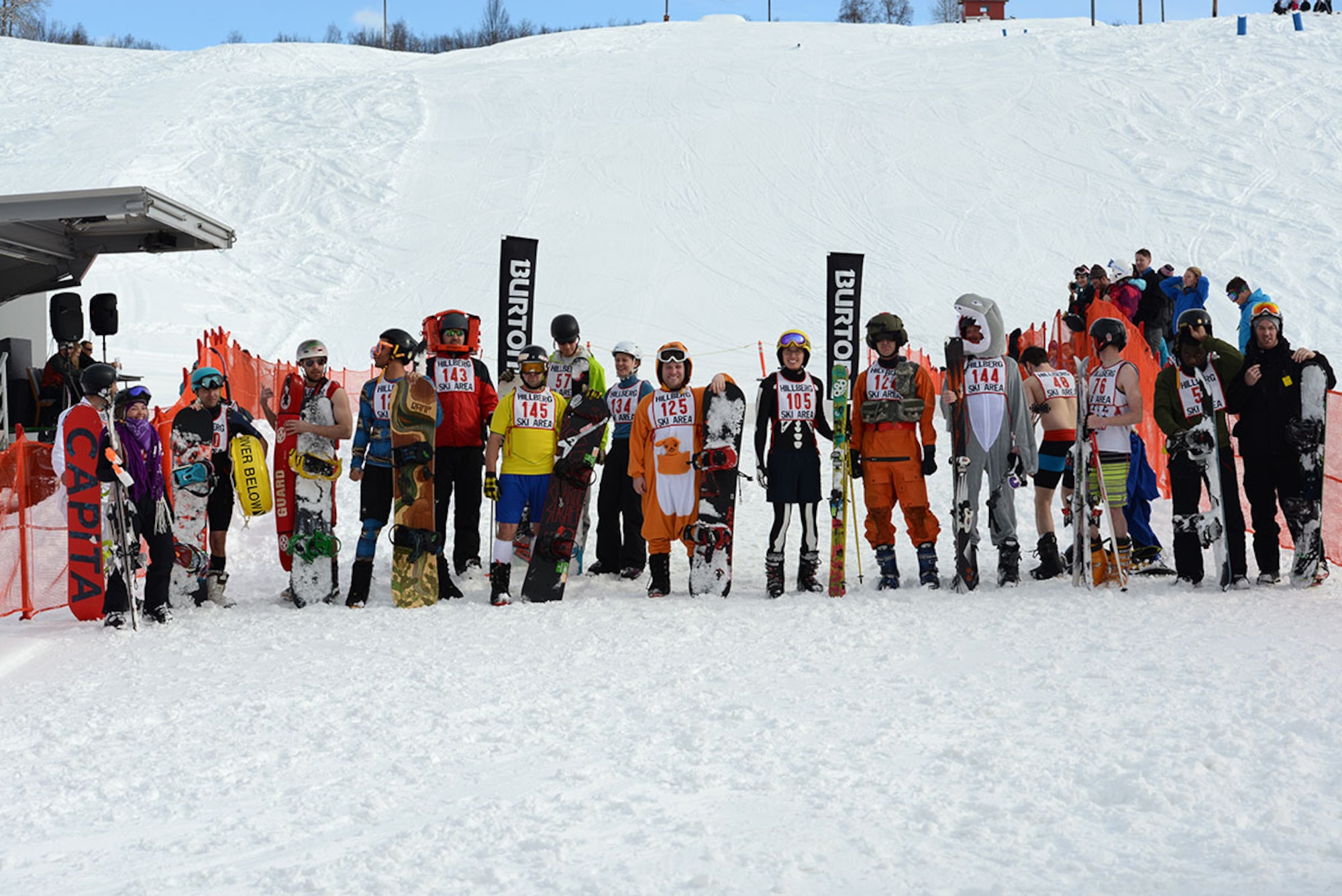 Skiers and snowboarders line up for a photograph before the Slush Cup during Hillberg Ski Resort’s Spring Meltdown at Joint Base Elmendorf-Richardson, Alaska, March 20, 2016. Participants skied or snowboarded across a slush pond, and prizes were given to a select few who made the cleanest run, sickest splash, and more. (U.S. Air Force photo by Airman 1st Class Christopher R. Morales)