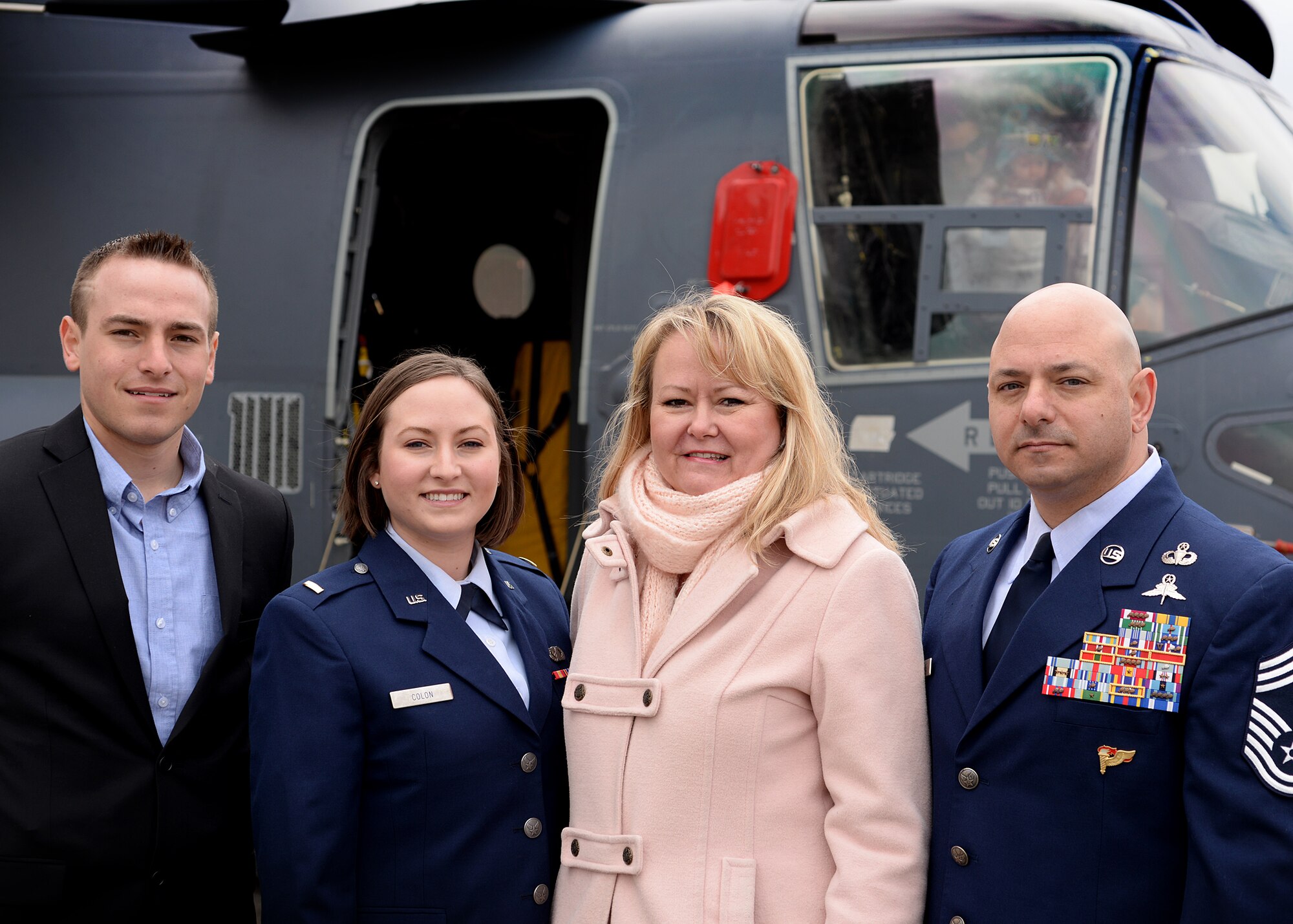 2nd Lt. Jenna Colón, 48th Contracting Squadron contracting specialist, and her father, Chief Master Sgt. Jason Colón, 387th Air Expeditionary Group superintendent, pose for a family photo at the conclusion of Chief Colon’s re-enlistment ceremony at Royal Air Force Mildenhall, England, March 21, 2016. The ceremony was one of many military milestones that the Colón family has shared over the past the past five generations. (U.S. Air Force photo/Technical Sgt. Matthew Plew)