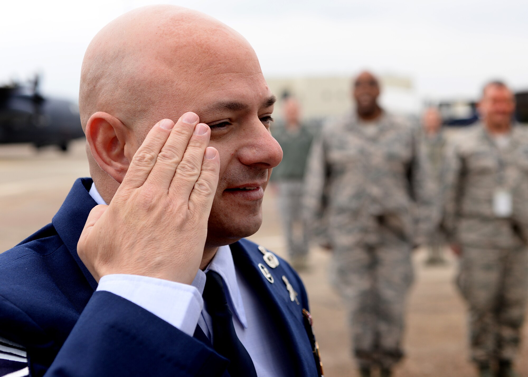 Chief Master Sgt. Jason Colón, 387th Air Expeditionary Group superintendent, renders a salute to his daughter, 2nd Lt. Jenna Colón, 48th Contracting Squadron contracting specialist, at the completion of his re-enlistment ceremony at Royal Air Force Mildenhall, England, March 21, 2016 Chief Colón was the first to salute his daughter upon her commissioning from the Reserve Officers Training Program at East Carolina University, N.C., May 9, 2015.  (U.S. Air Force photo/Technical Sgt. Matthew Plew)