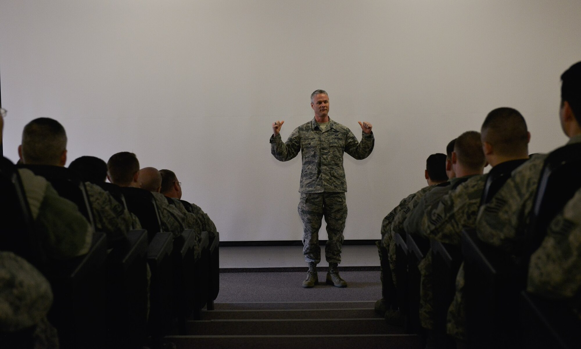 Col. Charles Henderson, 521st Air Mobility Operations Wing vice commander, speaks in front of a crowd of Airmen during the Air Force Assistance Fund kickoff March 21, 2016, at Ramstein Air Base, Germany. Henderson, alongside other base leaders, came to start the campaign by talking to Airmen about the importance of the program and how it can help those in need. (U.S. Air Force photo/Airman 1st Class Lane T. Plummer)