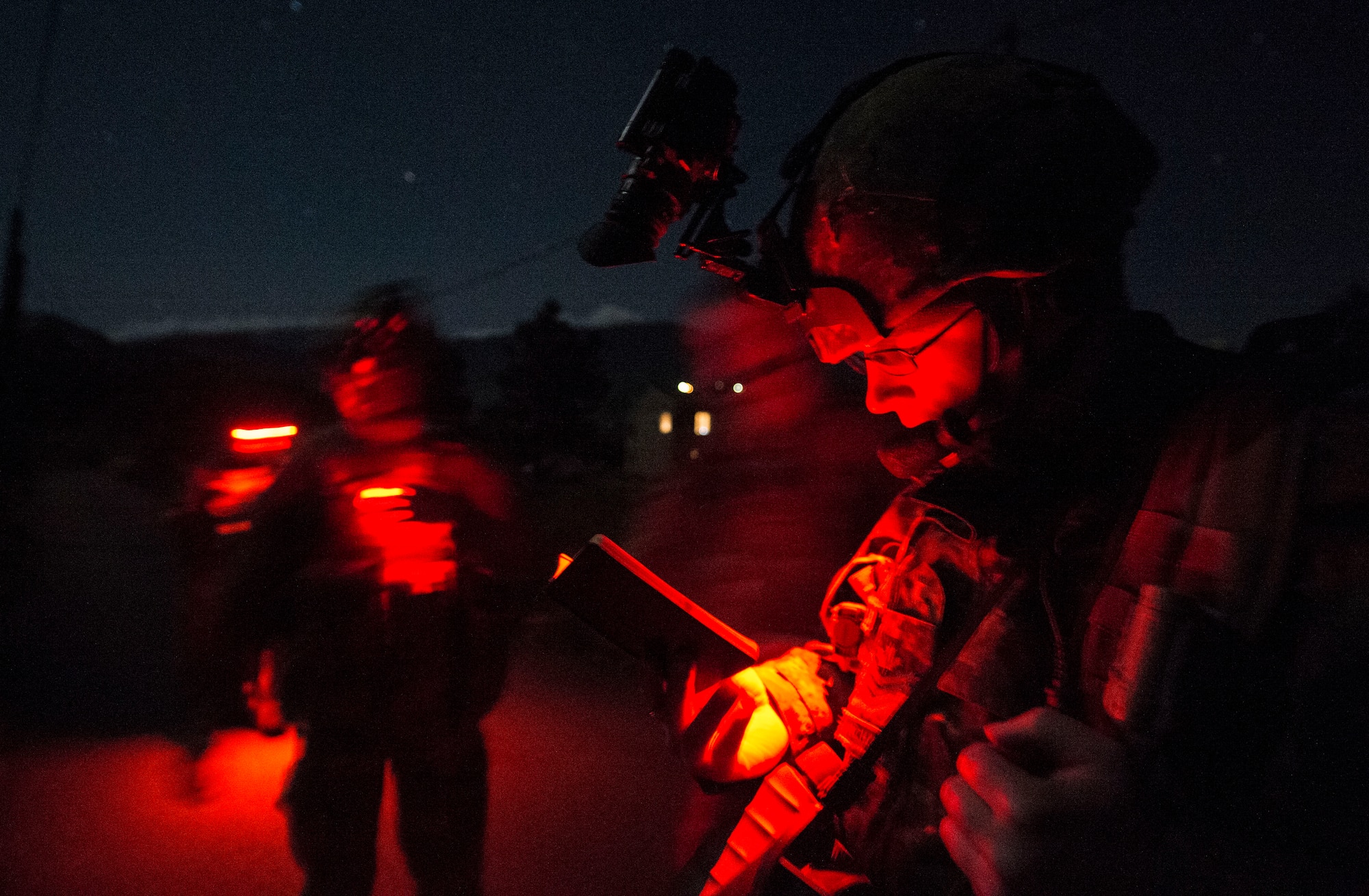 Sgt. Lane Starling, 1st Regiment, Royal Canadian Horse Artillery joint terminal attack controller, scans his area and speaks to a pilot as part of a night operations training scenario during exercise Serpentex ‘16 March 15, 2016, in Corsica, France. Training at night prepares JTACs to provide terminal control of both air and surfaced based fires at the tactical level in a more challenging setting.  Approximately 215 Airmen, including JTACs from the 2nd Air Support Operations Squadron, from Vilseck, Germany, participated in the annual exercise held at NATO’s tactical training center and the French air force’s Air Base 126 Solenzara, France. (U.S. Air Force/Staff Sgt. Sara Keller)