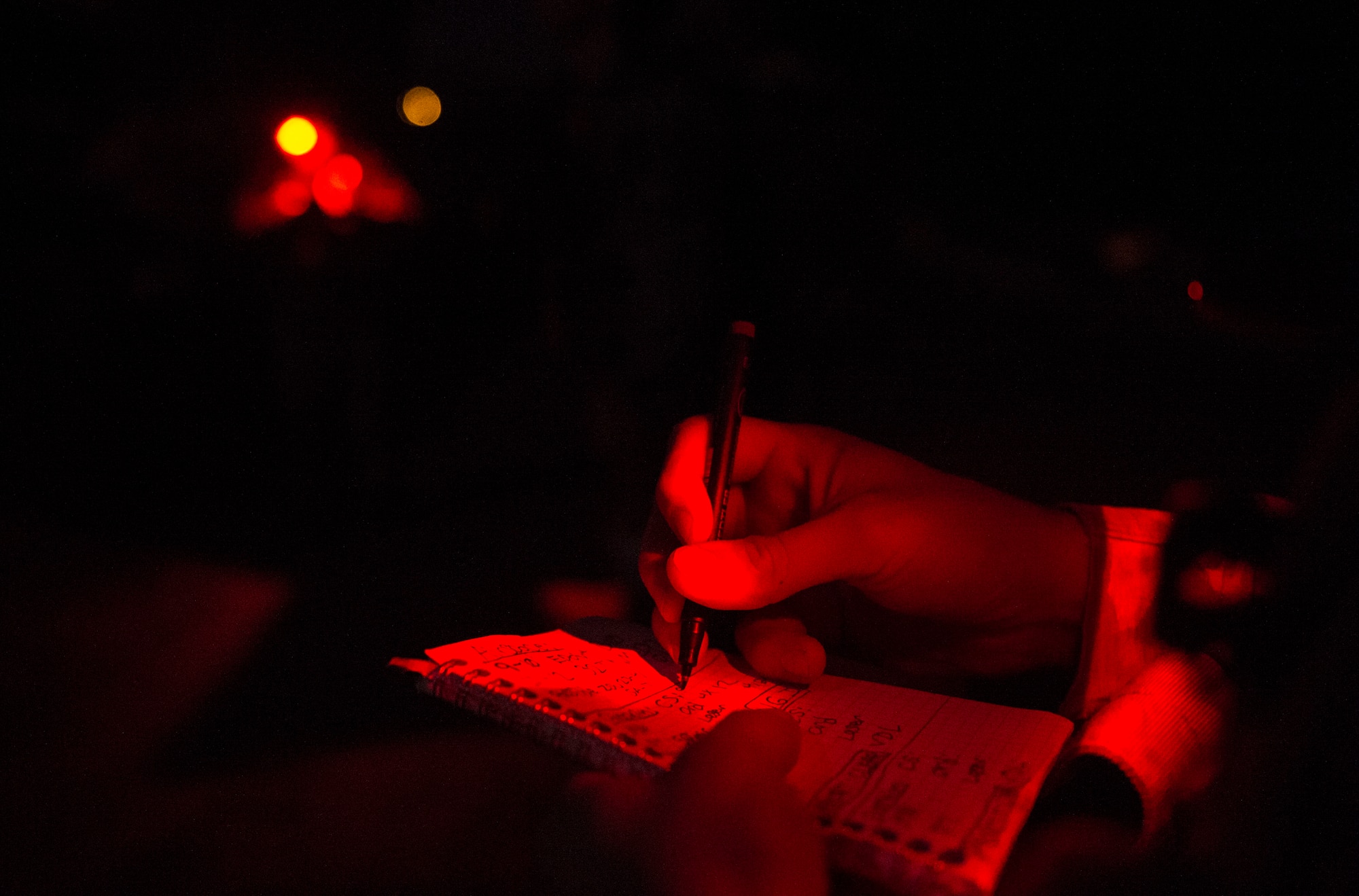 Senior Airman Gage Duvall, 2nd Air Support Operations Squadron joint terminal attack controller, takes notes during a training scenario at exercise Serpentex ‘16 March 15, 2016, in Corsica, France. Training at night helps JTACs hone their skills by using different tools and techniques to call in close air support in more challenging circumstances. (U.S. Air Force photo/Staff Sgt. Sara Keller)