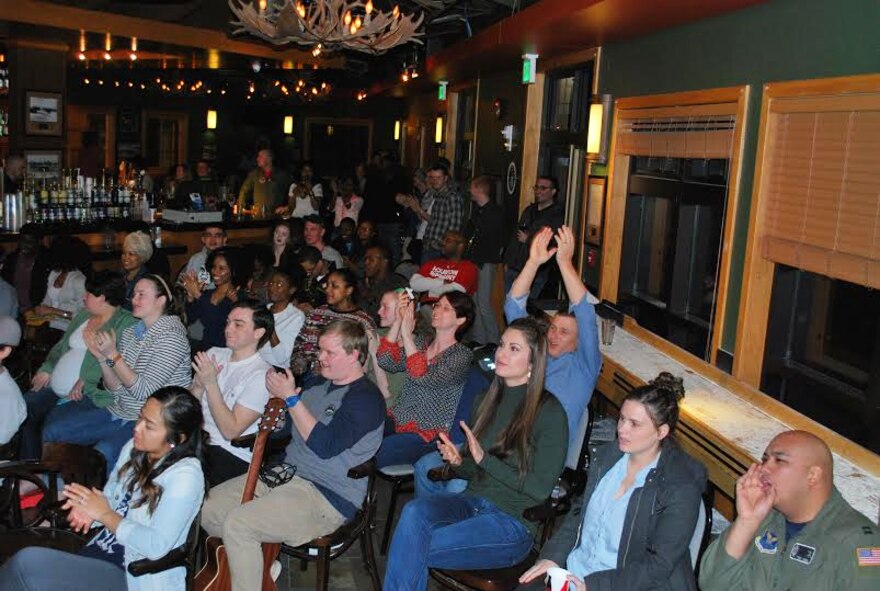 Spectators of Malmstrom Air Force Base’s first open mic night cheer for an act during the event, which was held at the Grizzly Bend Feb. 26, 2016. The next open mic night will take place Friday 6 p.m. at the Grizzly Bend. (Courtesy photo)