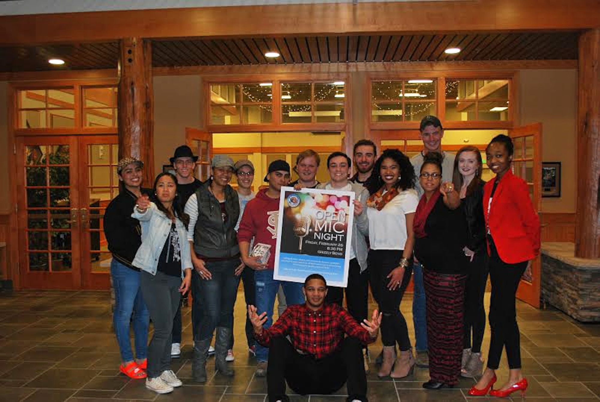 Participants of Malmstrom Air Force Base’s first open mic night pose for a photograph after wrapping up their performances at the Grizzly Bend Feb. 26, 2016. The first open mic night drew nearly 150 spectators to watch the show. Fourteen poets, singers, instrumentalists, dancers and storytellers took to the stage to display their skills and creativity. (Courtesy photo)