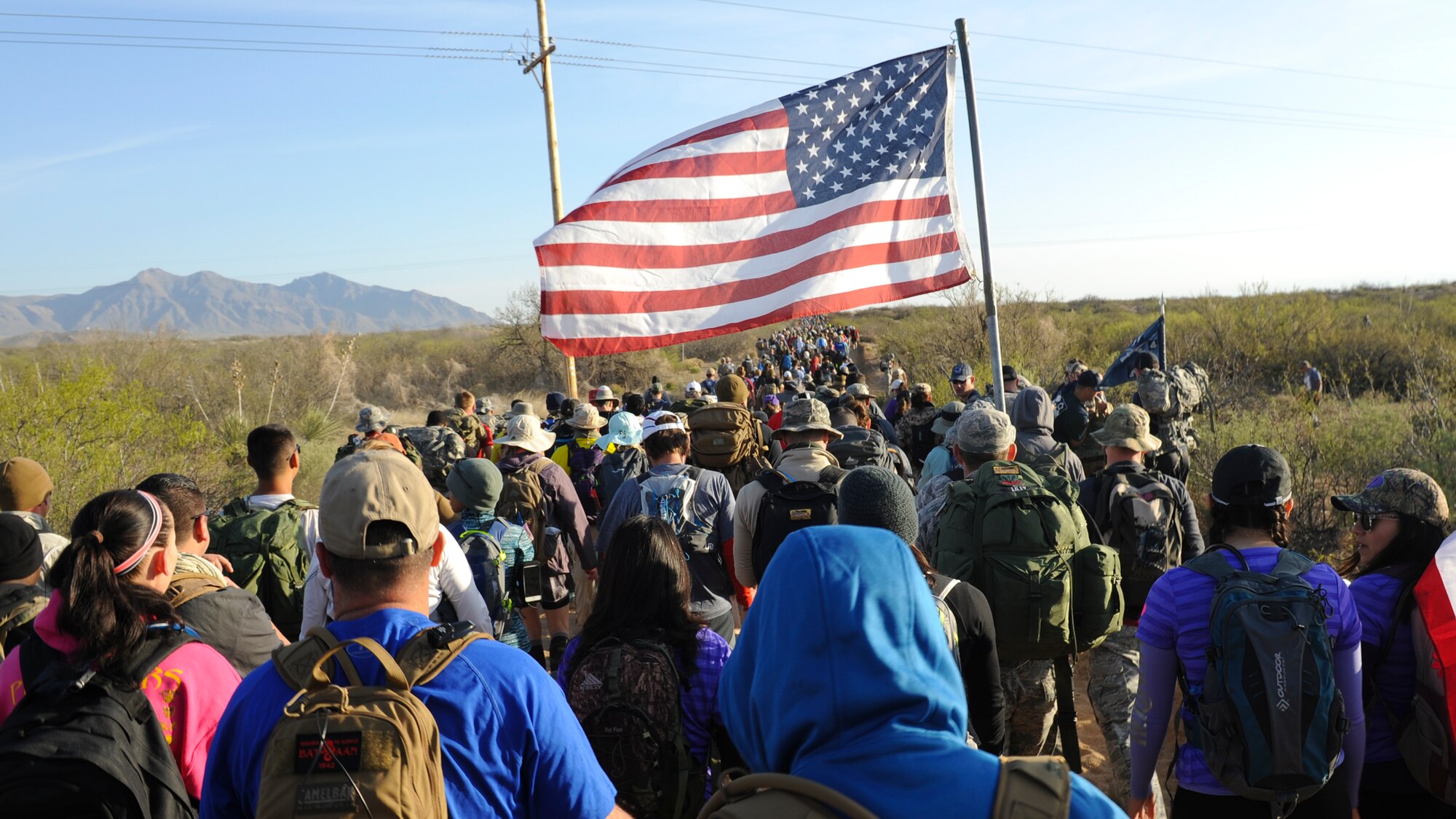 Military members, civilians, volunteers and veterans begin a 26.2-mile journey during the 2016 Bataan Memorial Death March, March 20, 2016, at White Sands Missile Range, N.M. The annual event draws more participants each year and provides today’s generation with a reminder of  harsh conditions that World War II veterans were forced to endure during their 60-mile march to a prisoner of war camp in the Philippines (U.S. Air Force photo/Senior Airman Harry Brexel)