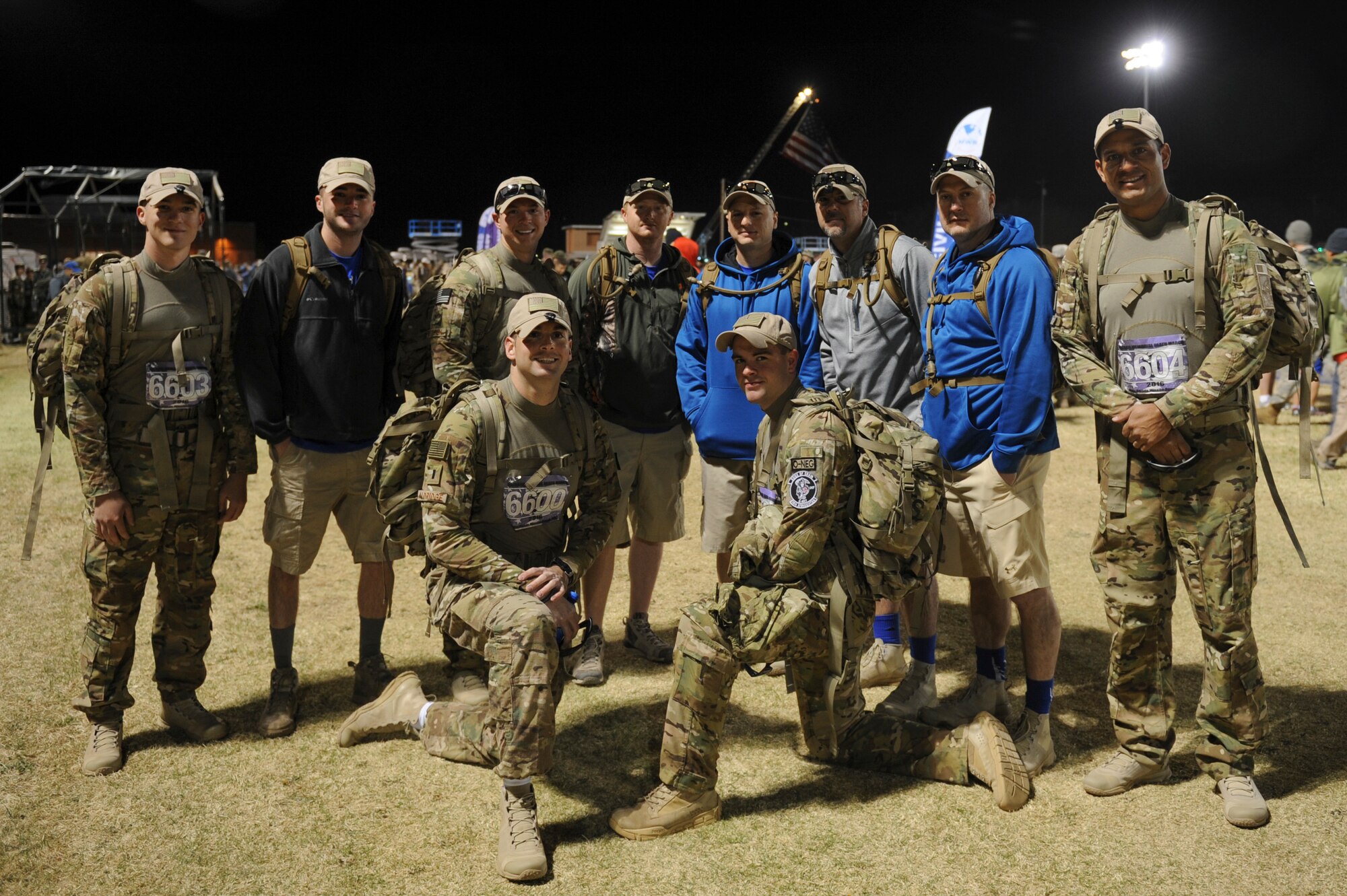 U.S. Airmen assigned to Little Rock Air Force Base, Ark., pose for a photo in the early morning prior to the start of the 2016 Bataan Memorial Death March at White Sands Missile Range, N.M., March 20, 2016. The two teams from the 19th Logistics Readiness Squadron both finished the 26.2-mile march in less than 9 hours. (U.S. Air Force photo by Senior Airman Harry Brexel)