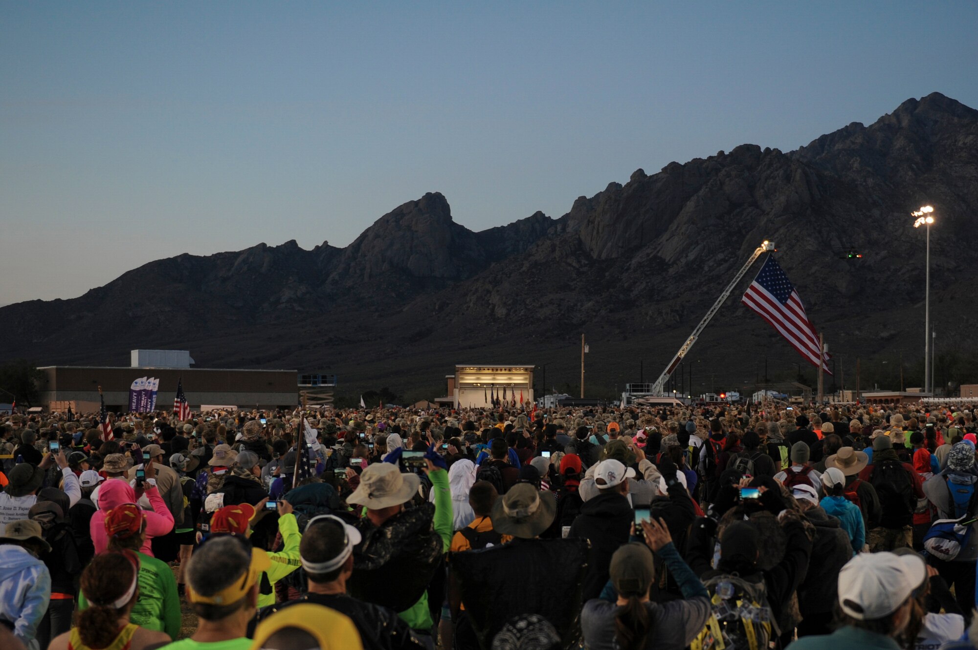 More than 6,600 military members, civilians, volunteers and veterans gather to honor World War II survivors prior to the start of the 2016 Bataan Memorial Death March at White Sands Missile Range, N.M., March 20, 2016. Two teams from Little Rock Air Force Base, Ark., participated in this year’s memorial march. (U.S. Air Force photo/Senior Airman Harry Brexel)