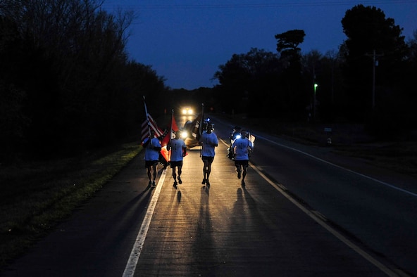 A team of Little Rock Air Force Base, Ark. first sergeants start Day Two of the Arkansas Run for the Fallen event March 19, 2016, in Clarksville, Ark. The 5th Annual Arkansas Run for the Fallen event is a cross-state run of 143 miles where each mile marks a fallen hero and has been identified with an American flag and a biography of each. (U.S. Air Force photo by Senior Airman Kaylee Clark)